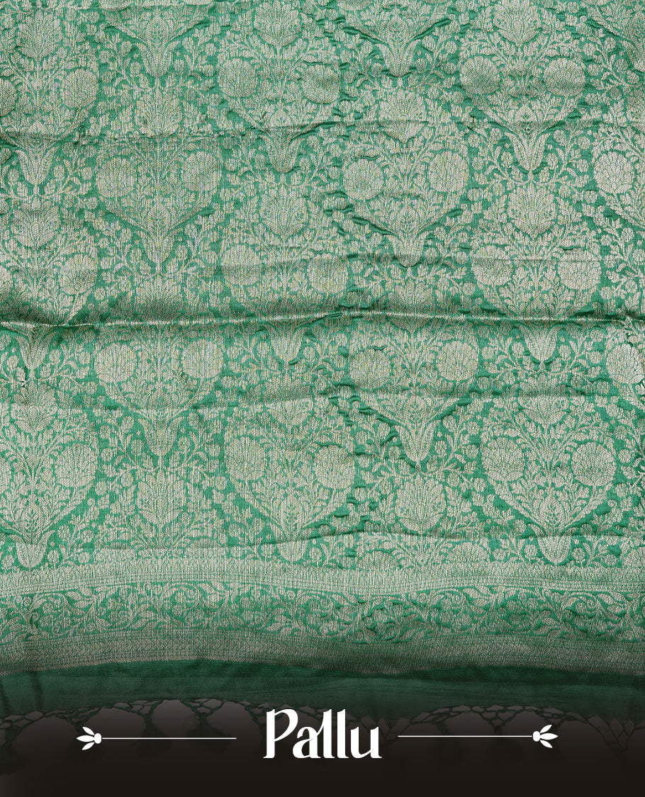 Green  colour pure tussar silk saree featuring light gold zari floral kodi work on the body, a plain border, grand pallu, Paired With  a matching blouse piece.