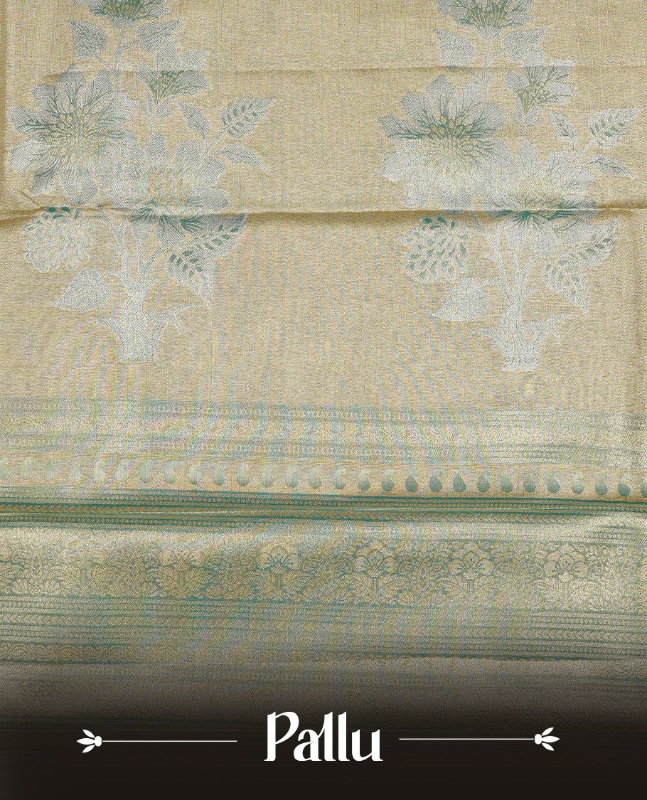 Light Green colour Tissue saree featuirng Green, Gold, silver zari Scales design on body, complemented by traditional border on self colour, paired with matching blouse piece.