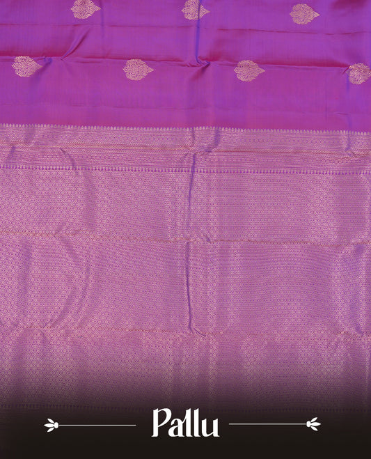 Indigo colour Vasundhara silk saree adorned with all-over gold motifs on the body, complemented by a self colour with gold tarditional border and paired with a matching blouse piece.