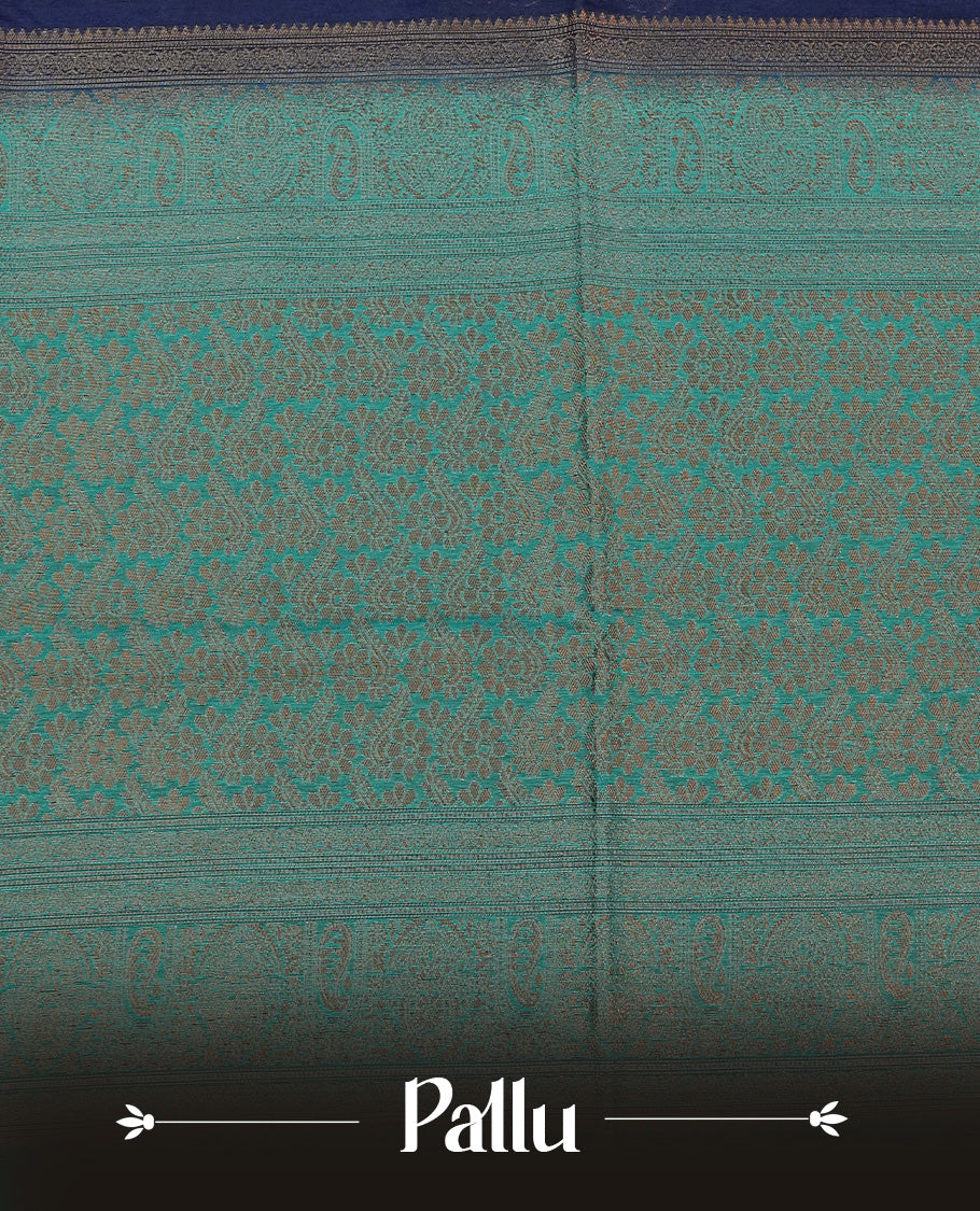 Navy blue colour semi linen saree with elegant gold zari leaf motifs across the body, complemented by a contrast peacock green pallu and a borderless design, paired with a matching blouse piece.