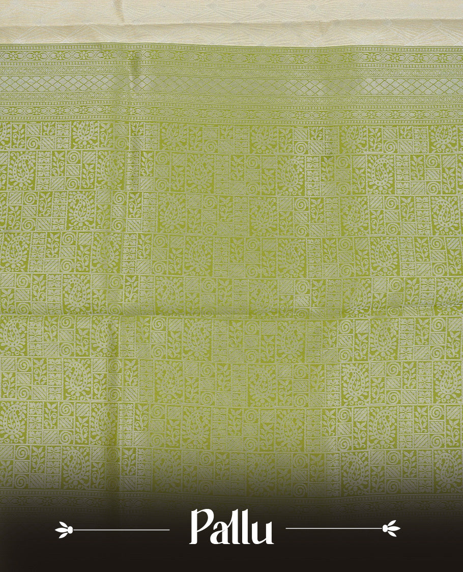 Pastel yellow colour semi silk saree featuring Silver zari pattern on body, complemented by contrast Green colour with silver zari border, comes with matching blouse piece.