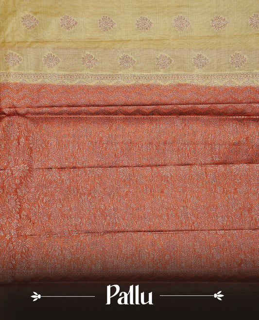 Pale Yellow Colour Tussar silk saree featuring Antique Zari motifs on body, Finished with contrast Orange colour Zigzag zari pattern border, paired with matching blouse piece.