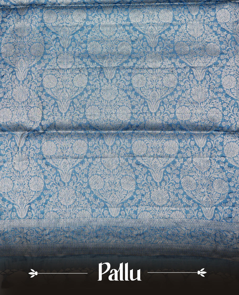 Teal Blue  colour Pure tusser silk saree featuring Silver  Zari floral Kodi Work On Body , A Plain  border & Grand  pallu ,Paired With  a matching blouse piece.