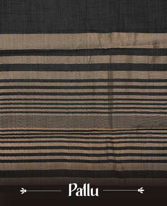 Blackish Grey colour semi tussar silk saree featuring an elegant plain body with traditional gold zari detailed border for a refined look. Comes paired with a matching blouse piece.