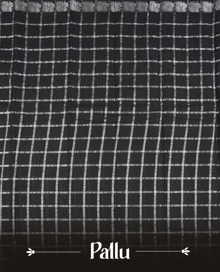 Black colour Chettinad cotton saree featuring silver checked patterns on the body, accentuated with elegant silver peacock motifs along the border & Comes with a matching blouse piece.