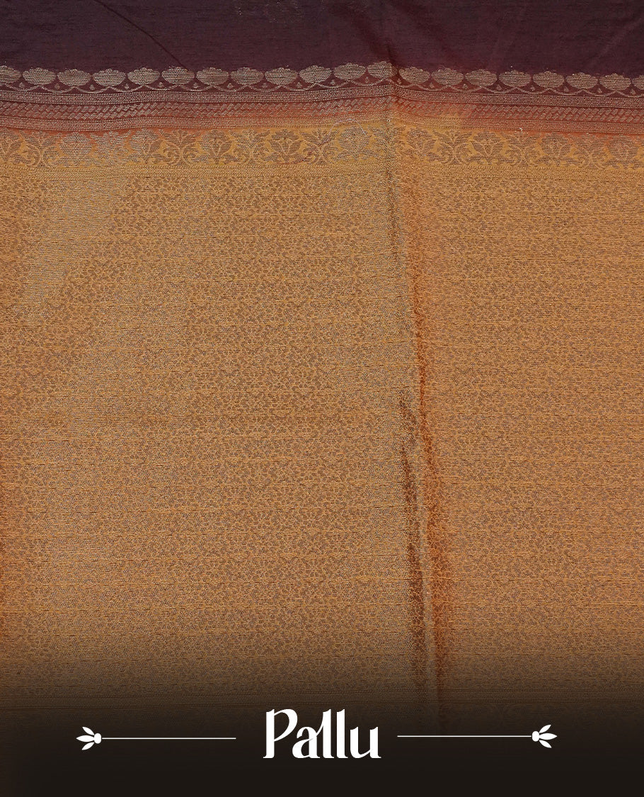 Chocolate brown colour semi linen saree with elegant gold zari floral motifs across the body, complemented by a contrast colour with grand gold zari pallu and a borderless design, paired with a matching blouse piece.