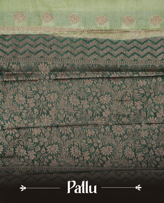 Pastel Green Colour Tussar silk saree featuring Antique Zari motifs on body, Finished with contrast Green colour Zigzag zari pattern border, paired with matching blouse piece.