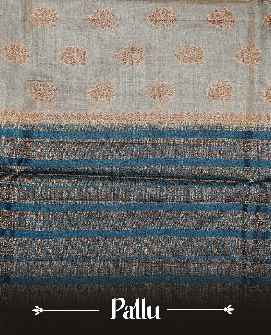 Golden Cream Colour Banaras tussar silk saree featuring Antique zari Motifs on body, Complemented by Blue colour variant with zari border, paired with matching blouse Piece.