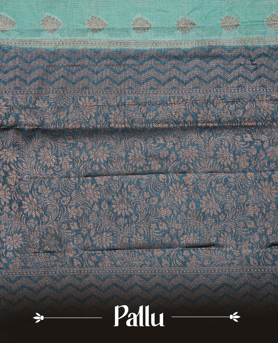 Aqua Colour Tussar silk saree featuring Antique Zari motifs on body, Finished with contrast Teal colour Zigzag zari pattern border, paired with matching blouse piece.