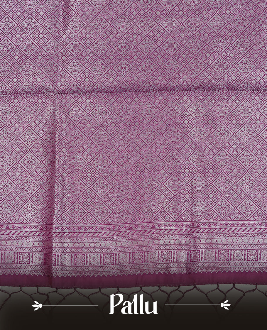 Pink colour semi silk saree featuring Silver zari Floral pattern on body, complemented by contrast Purple colour with silver zari border, comes with matching blouse piece.