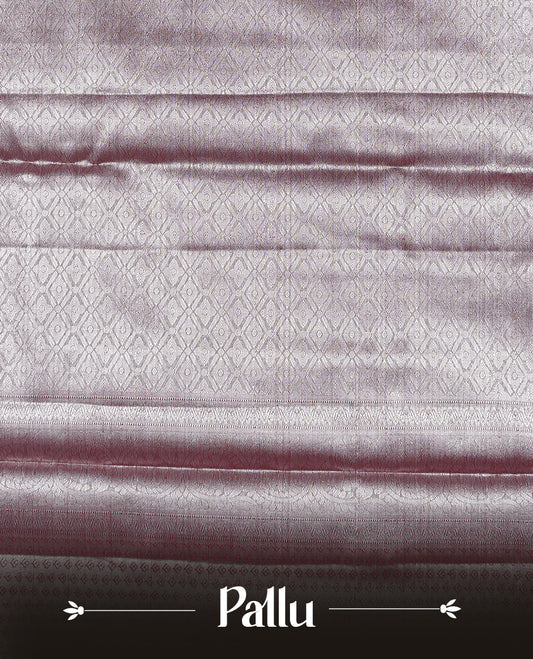 Silver & Maroon colour Tissue silk saree featuring Maroon & Silver zari kodi pattern on body, enhanced with Zari border on self colour, paired with matching Blouse piece.