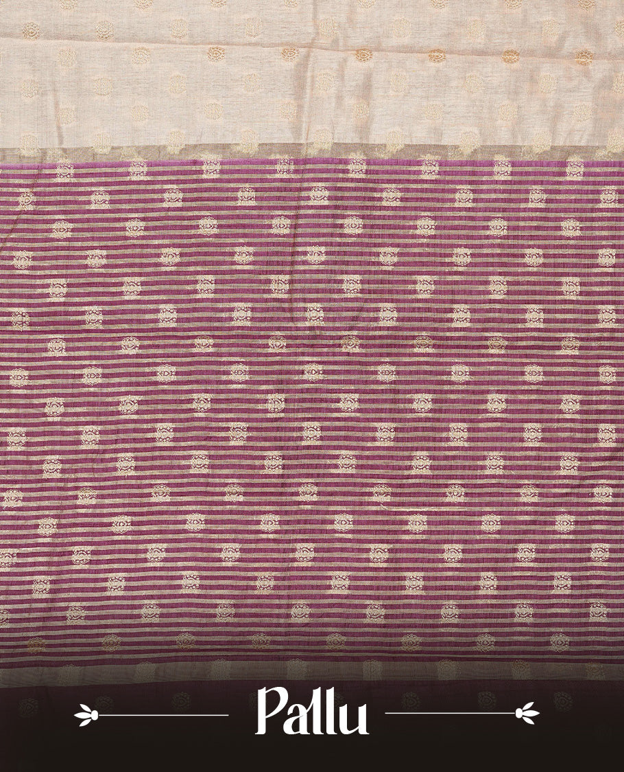 Light Gold Tussar saree featuring Gold zari buttas on body, complemented by contrast Purple Colour with Gold zari border, comes with matching blouse piece.