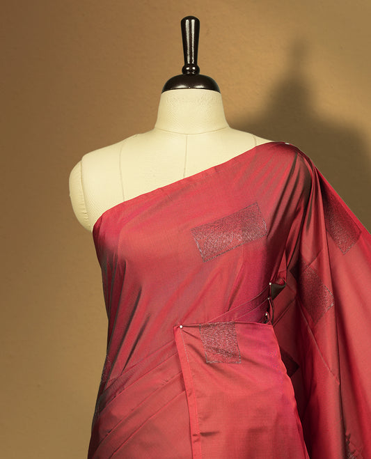 Dual tone medium copper & green  semi soft silk saree adorned with woven square motifs on the body, complemented by a rich contrast woven pallu with tassel detailing & Comes with a matching blouse piece.