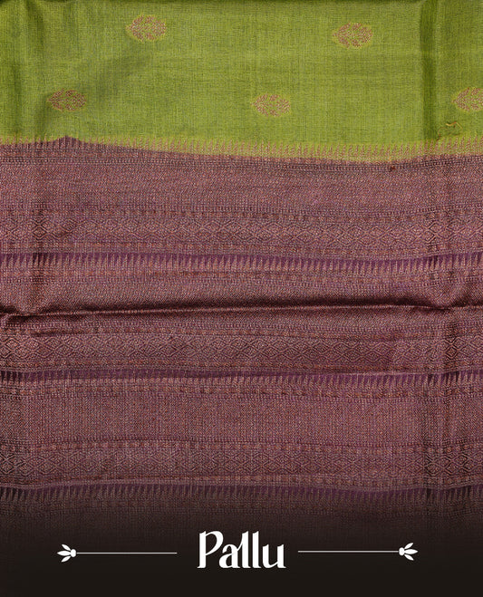 Olive Green colour Pure Banaras Tussar silk saree Featuring Gold zari buttas on body, complemented by Contrast Dark Brown colour with zari border, paired with matching blouse piece.