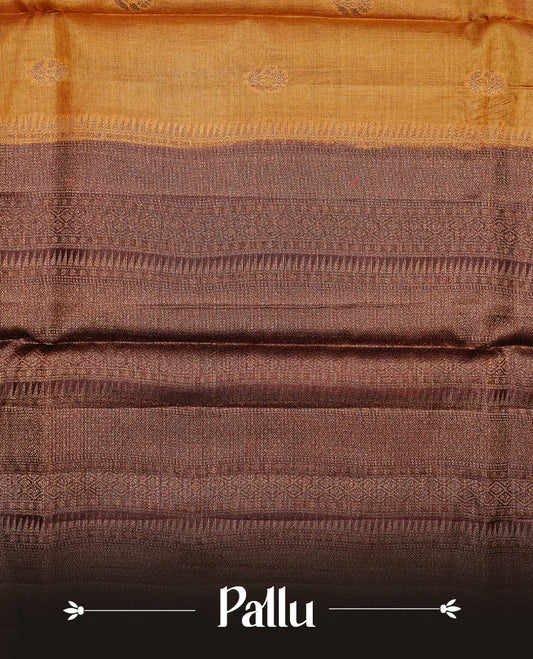 Mustard colour Pure Banaras Tussar silk saree Featuring Gold zari buttas on body, complemented by Contrast Chocolate colour with zari border, paired with matching blouse piece.
