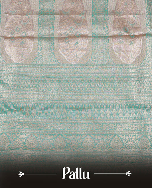 Light Pink colour Tissue silk saree featuring Green colour floral zari motifs on body, complemented by contrast Light green zari border, paired with matching blouse piece.