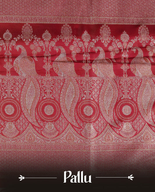 Red colour Mulberry silk saree featuring Gold zari buttas on body, complmented by self colour with Gold zari dual peacock in Temple design border, comes with matching blouse piece.
