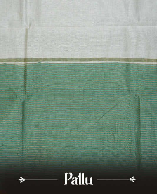 White cream colour Semi Tussar silk saree featuring an elegant plain body, accentuated by a contrast Aqua green border adorned with intricate gold zigzag zari work, paired with a matching blouse piece.