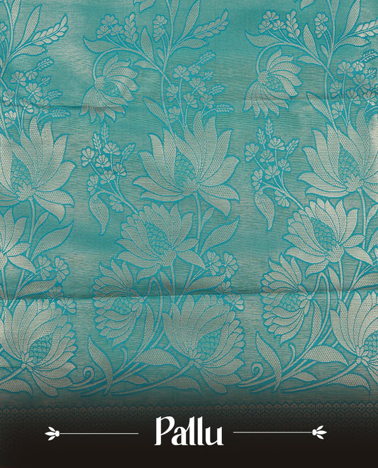 Green colour semi wedding silk saree featuring Gold zari floral kodi pattern on body, complemented by Traditional zari on self colour with Maroon piping, paired with matching blouse piece.
