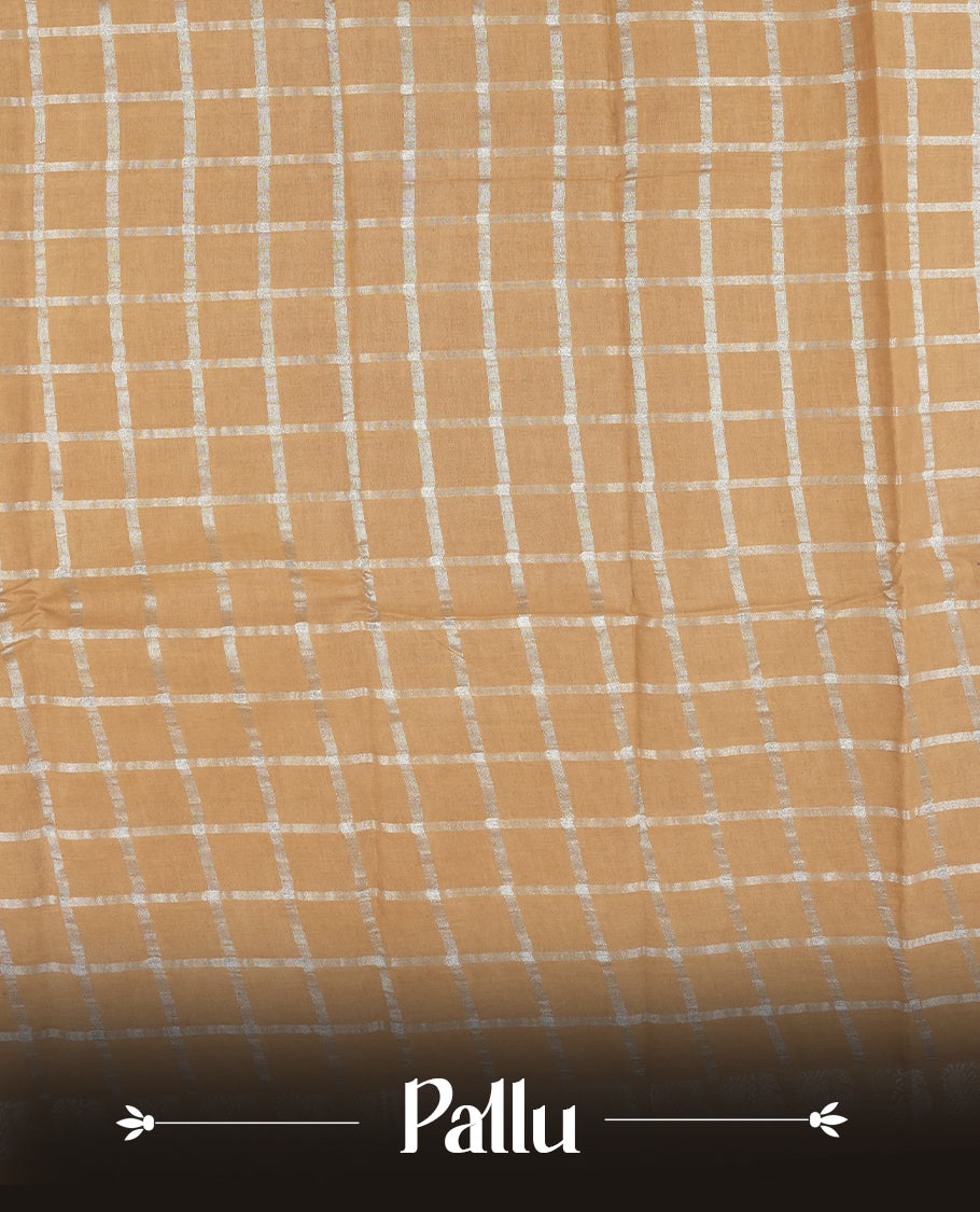 Pastel brown colour Chettinad cotton saree featuring silver checked patterns on the body, accentuated with elegant silver peacock motifs along the border & Comes with a matching blouse piece.