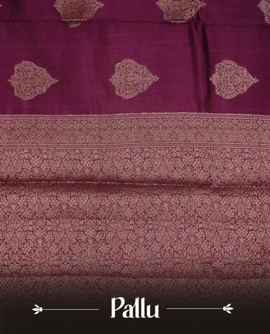Burgundy Colour Pure Banaras Soft Silk saree featuring Antique Zari buttas in body, complemented by zari work on self colour border, paired with matching Blouse Piece.