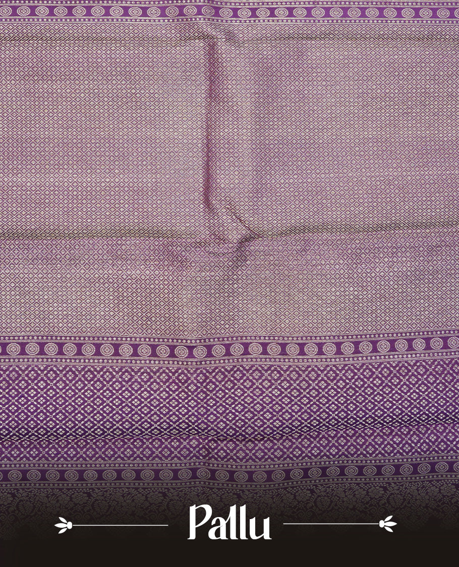 Purple colour Pure wedding silk saree featuring dotted Designed pattern on body, complemented by self colour with traditional border, comes with matching blouse piece.