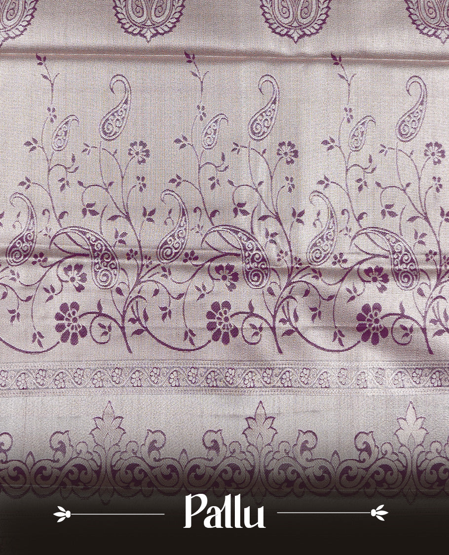Light green colour tissue saree featuring silver & gold zari floral kodi pattern on the body, highlighted by a contrast Burgundy colour border with gold traditional zari, paired with a matching blouse piece.