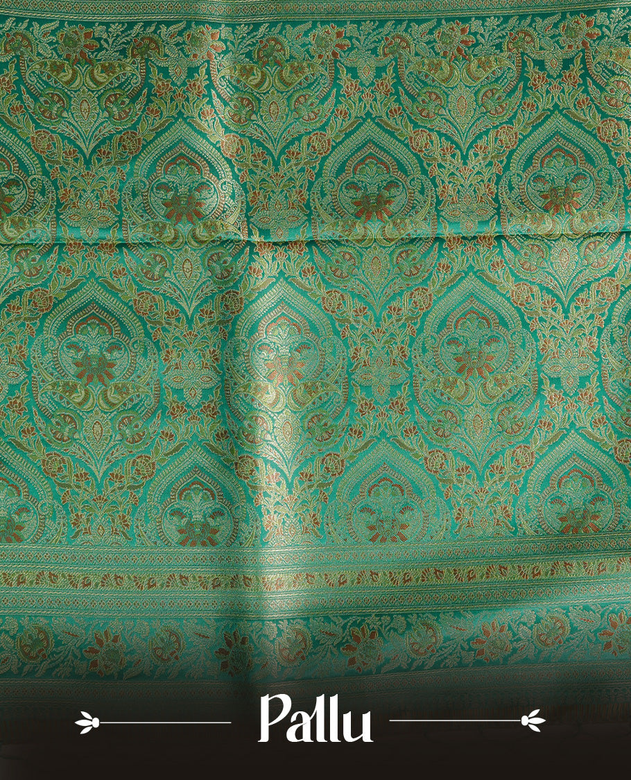 Green colour Mulberry silk saree featuring gold zari Mango & floral kodi pattern across body, complemented by self colour border with gold zari work, comes with matching blouse piece.