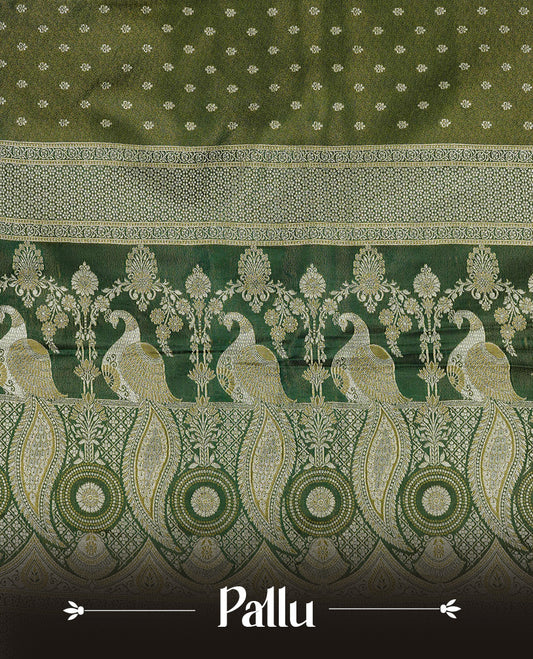 Green colour Mulberry silk saree featuring Gold zari buttas on body, complmented by self colour with Gold zari dual peacock in Temple design border, comes with matching blouse piece.