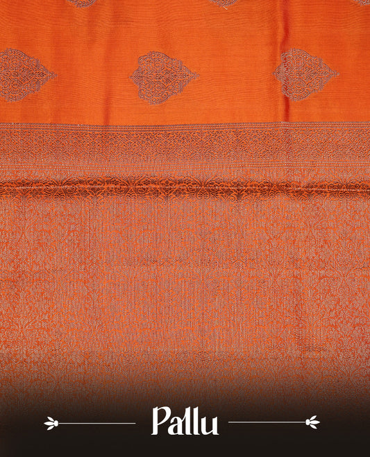 Orange Colour Pure Banaras Soft Silk saree featuring Antique Zari buttas in body, complemented by zari work on self colour border, paired with matching Blouse Piece.