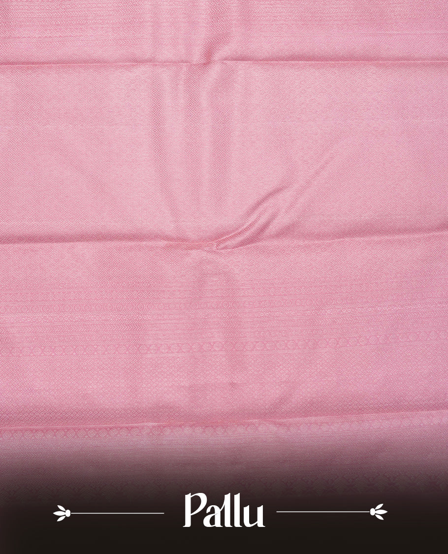 Baby pink colour pure wedding silk saree featuring Light gold zari Floral kodi pattern on body, complemented by self colour with traditional border, comes with matching blouse piece.