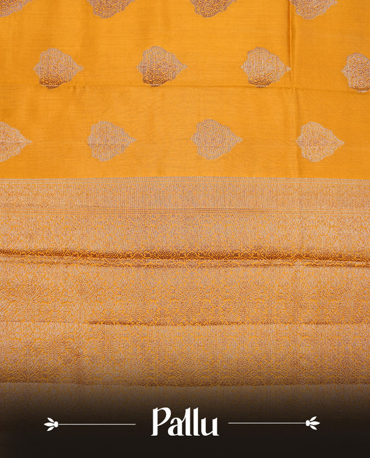 Mustard Colour Pure Banaras Soft Silk saree featuring Antique Zari buttas in body, complemented by zari work on self colour border, paired with matching Blouse Piece.