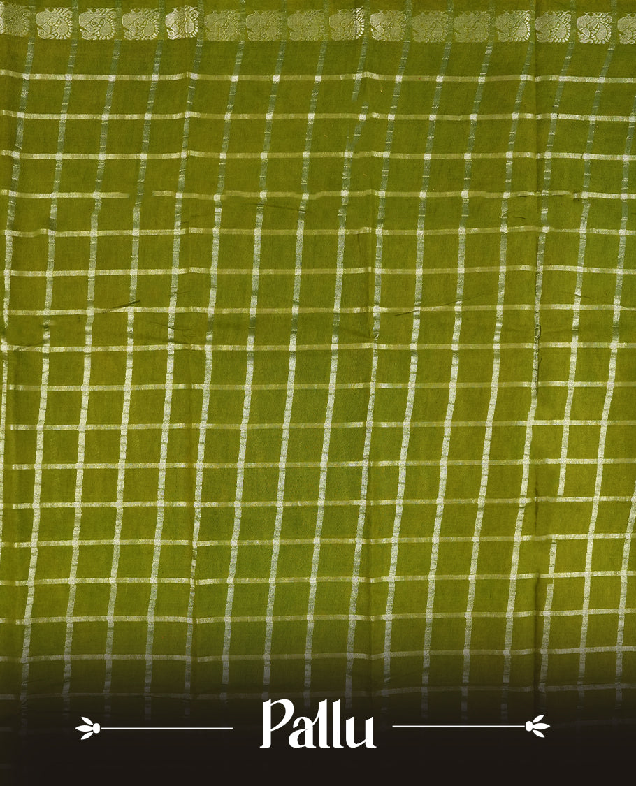 Olive green colour Chettinad cotton saree featuring silver checked patterns on the body, accentuated with elegant silver peacock motifs along the border & Comes with a matching blouse piece.