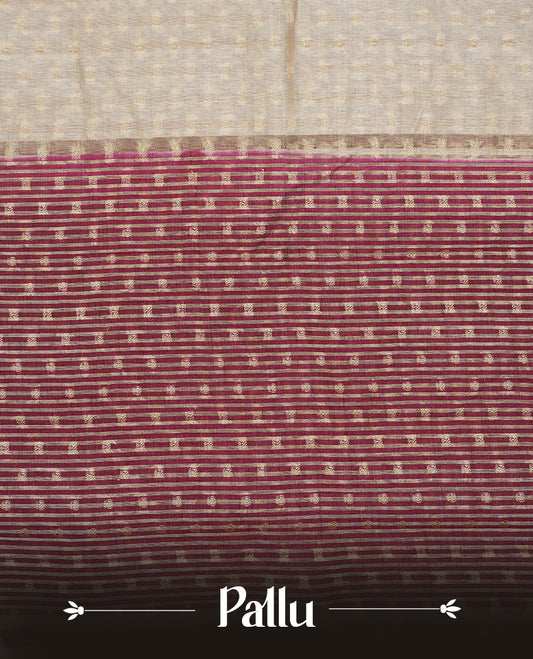 Cream colour Semi Tussar silk saree featuring an Gold zari motifs on body, accentuated by a contrast Maroon border adorned with intricate gold zari work, paired with a matching blouse piece.