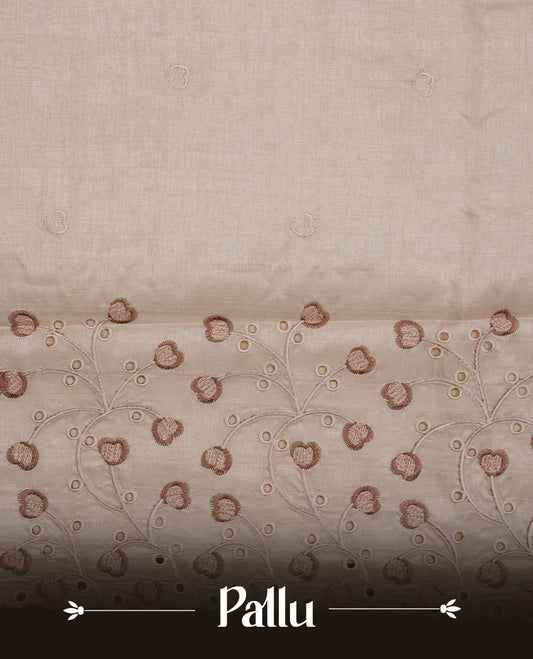 Beige colour Tussar silk saree featuring Elegant plain body, highlighting Brown colour thread floral kodi worked scalp border, pallu and paired with matching blouse piece.