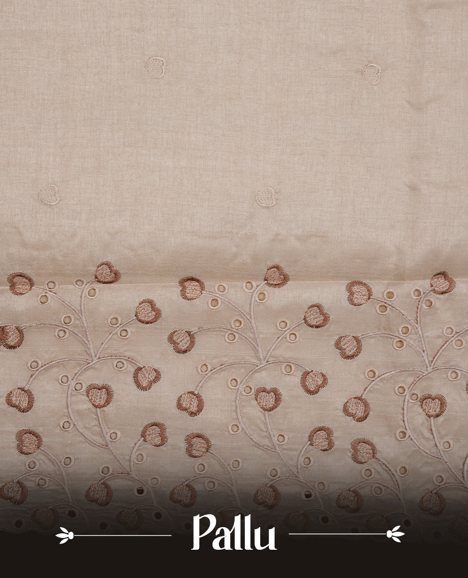 Beige colour Tussar silk saree featuring Elegant plain body, highlighting Brown colour thread floral kodi worked scalp border, pallu and paired with matching blouse piece.