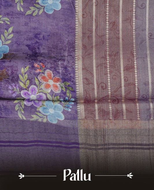 Purple colour banaras silk saree featuring Floral print on body, complemented by Light gold zari border with striped pallu, comes with matching blouse piece.