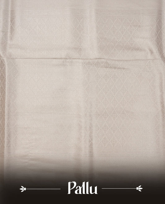 Off white colour softie silk saree featuring silvar zari, rich pallu floral pattern brocade body, with contrasting self colour border.paired with matching blouse piece.