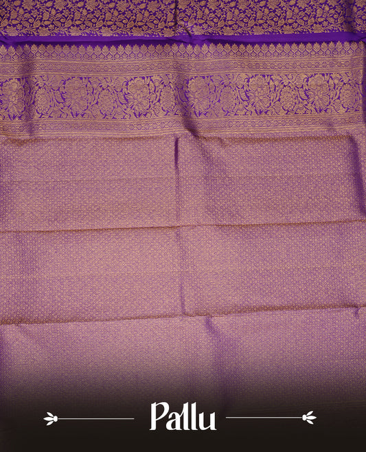 Indigo colour kancheepuram silk saree featuring gold zari pattern across body, complemented by selfcolour border traditional zari border, paired with matching blouse piece.