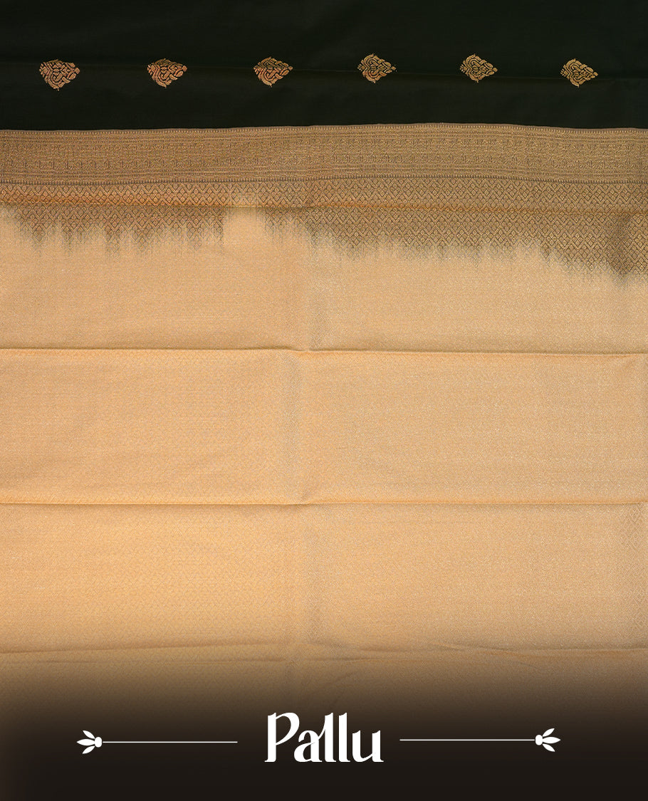 Dark green coloured soft silk saree featuring gold zari motifs across the body, enhanced with a contrast Cream border and pallu, paired with a matching contrast blouse piece.