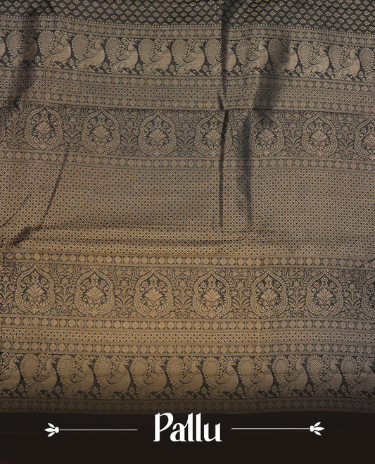 Black colour semi soft silk saree featuring gold zari motifs on across body, self colour border with traditional gold zari pattern, pallu and paired with matching blouse.