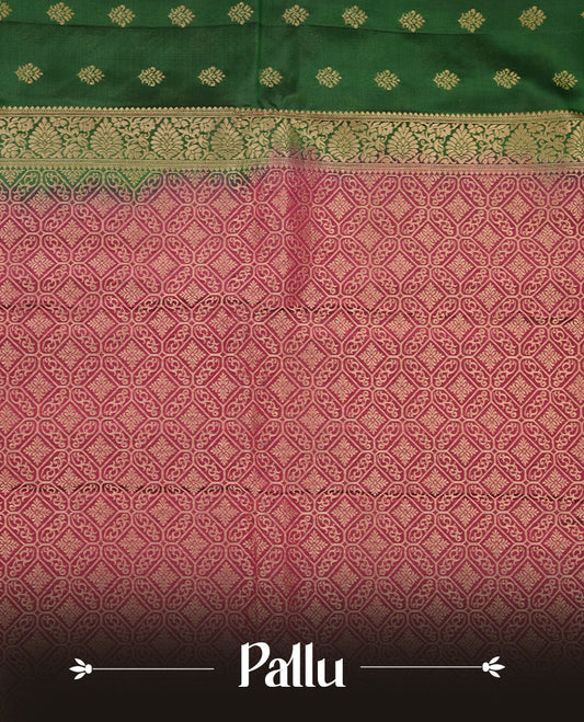 Green colour soft silk saree featuring gold zari motifs on the body, complemented by a contrast Maroon traditional zari border and pallu, paired with a matching blouse piece.