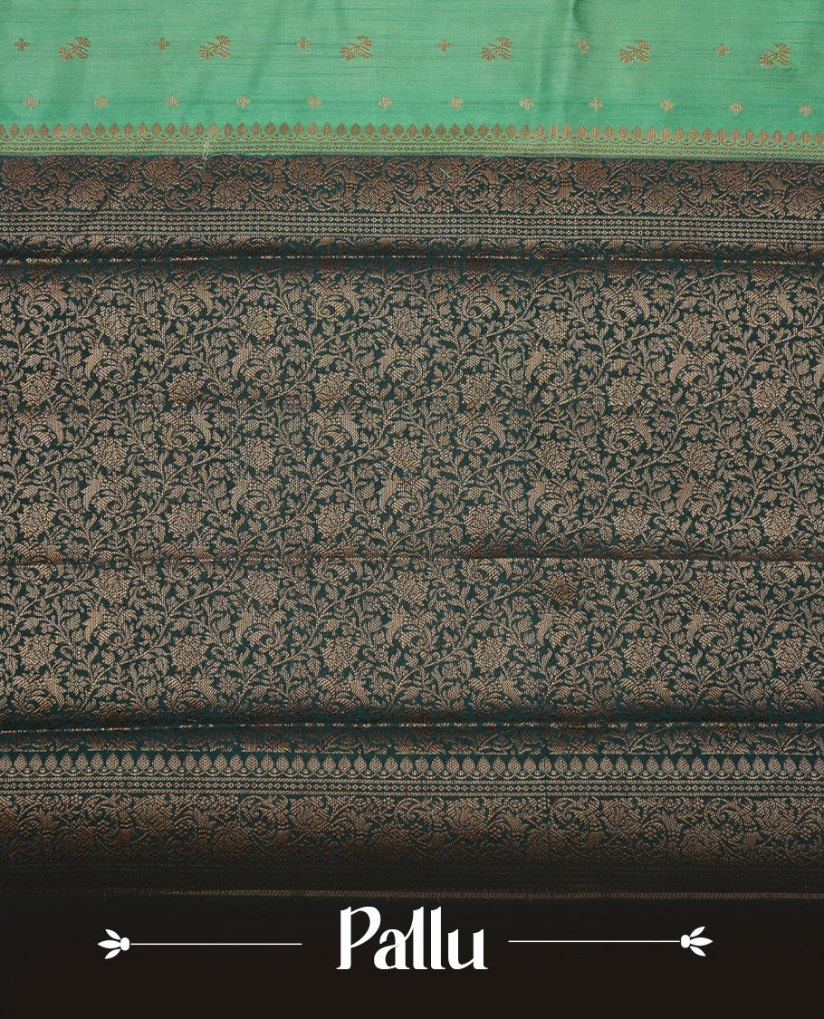 Teal colour Pure banaras soft silk saree featuring Antique zari motifs on body, contrast dark teal colour border , traditional pallu and paired with matching blouse