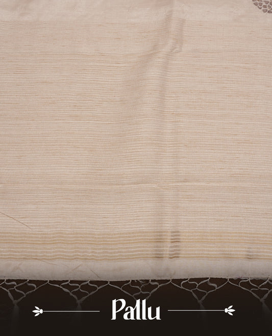 Beige colour Tussar silk saree featuring Elegant plain body, highlighting Grey colour floral cut work with Light gold zari border, pallu and paired with matching blouse piece.