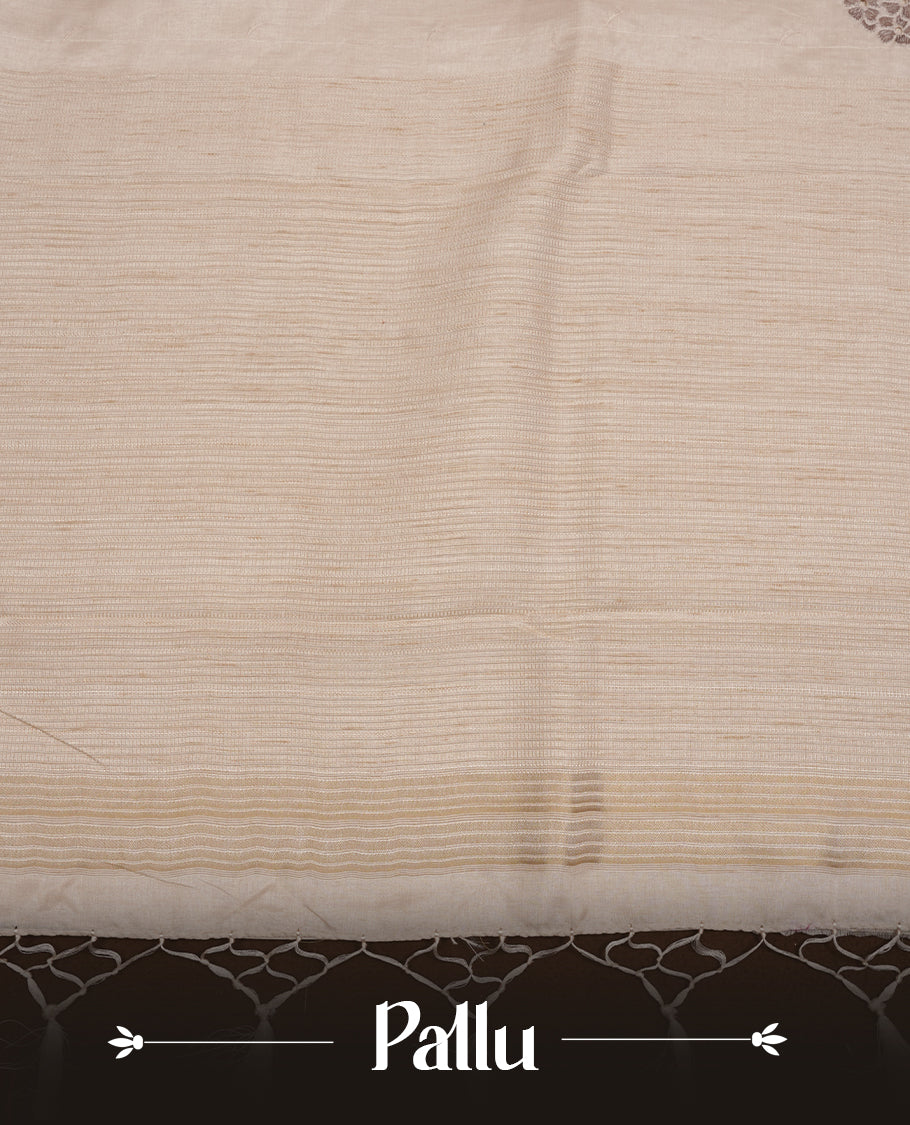Beige colour Tussar silk saree featuring Elegant plain body, highlighting Grey colour floral cut work with Light gold zari border, pallu and paired with matching blouse piece.