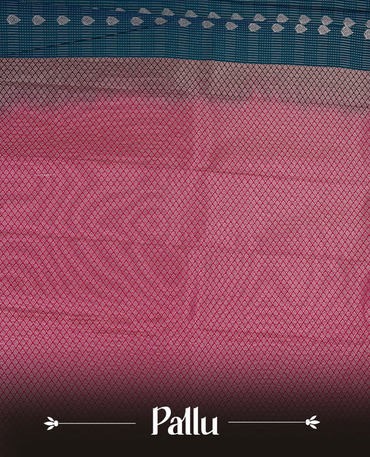 Teal coloured soft silk saree featuring gold zari stripes and motifs across the body, enhanced with a contrast Magenta border and pallu, paired with a matching contrast blouse piece.