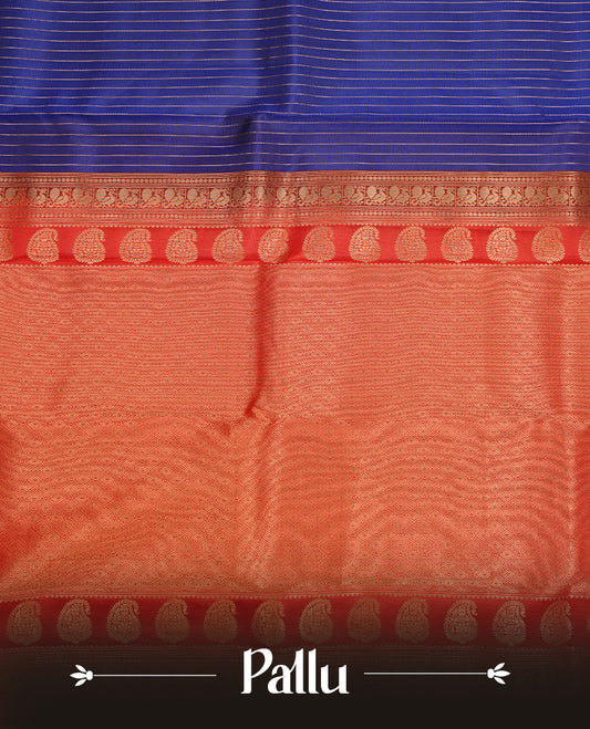 Navy blue colour traditional kancheepuram silk saree featuring gold zari strpies on body, complemented by contrast red colour with gold zari traditional border, paired with matching blouse piece.