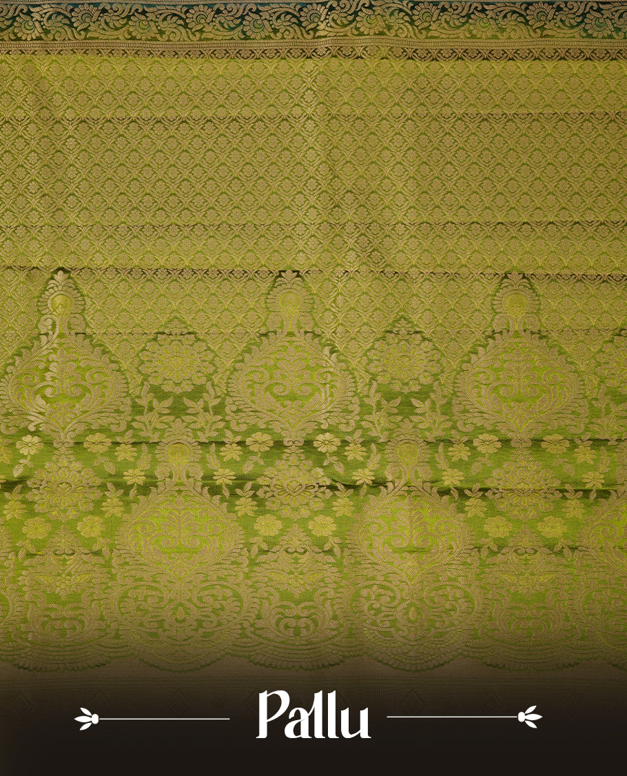 Teal colour soft silk saree featuring gold zari motifs on the body, complemented by a contrast Green traditional zari border and pallu, paired with matching blouse piece.