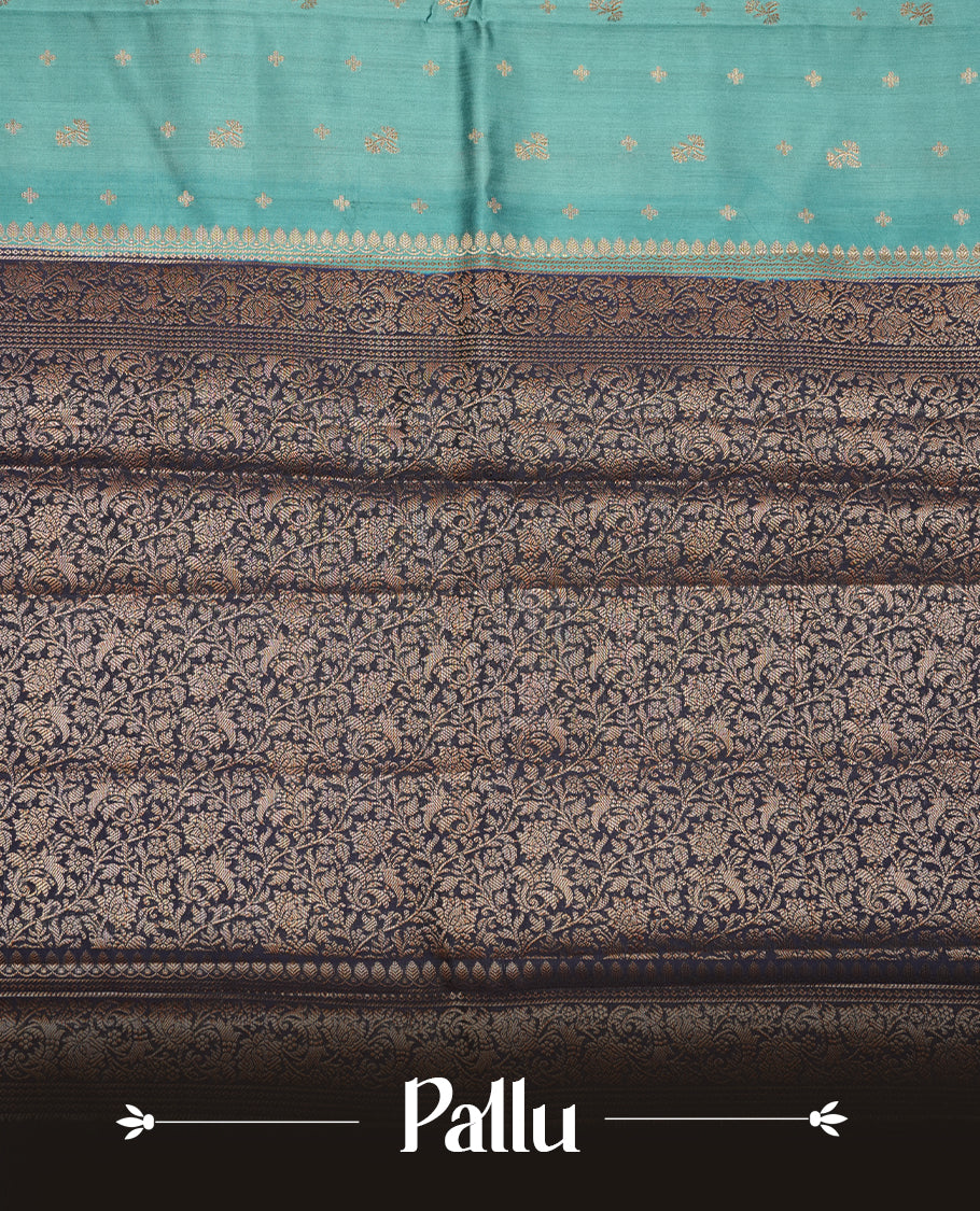 Steel blue colour Pure banaras soft silk saree featuring Antique zari motifs on body, contrast navy blue colour border , traditional pallu and paired with matching blouse