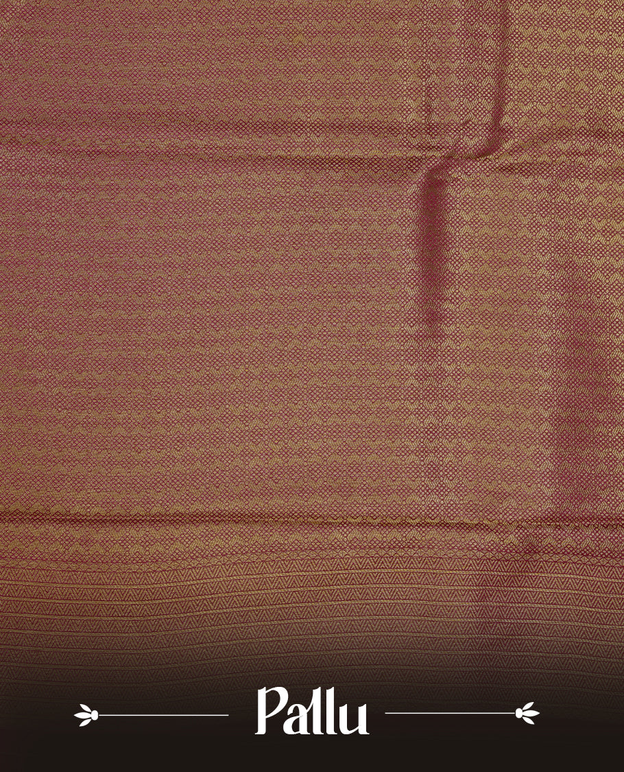 Burnt burgundy colour semi soft silk saree featuring gold zari motifs on across body, self colour border with traditional gold zari pattern, pallu and paired with matching blouse.